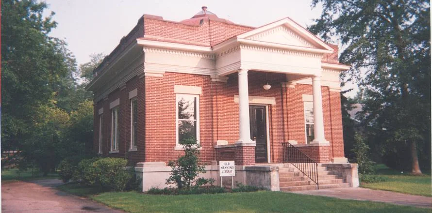 Clarendon County Archives and History Center, a building made from red brick with white windows and pillars